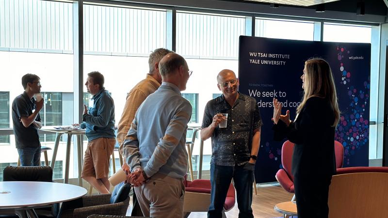 Wu Tsai Faculty Members connecting during the conference reception.