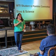 Giovanna speaking to an audience at the WTI Sips & Science event
