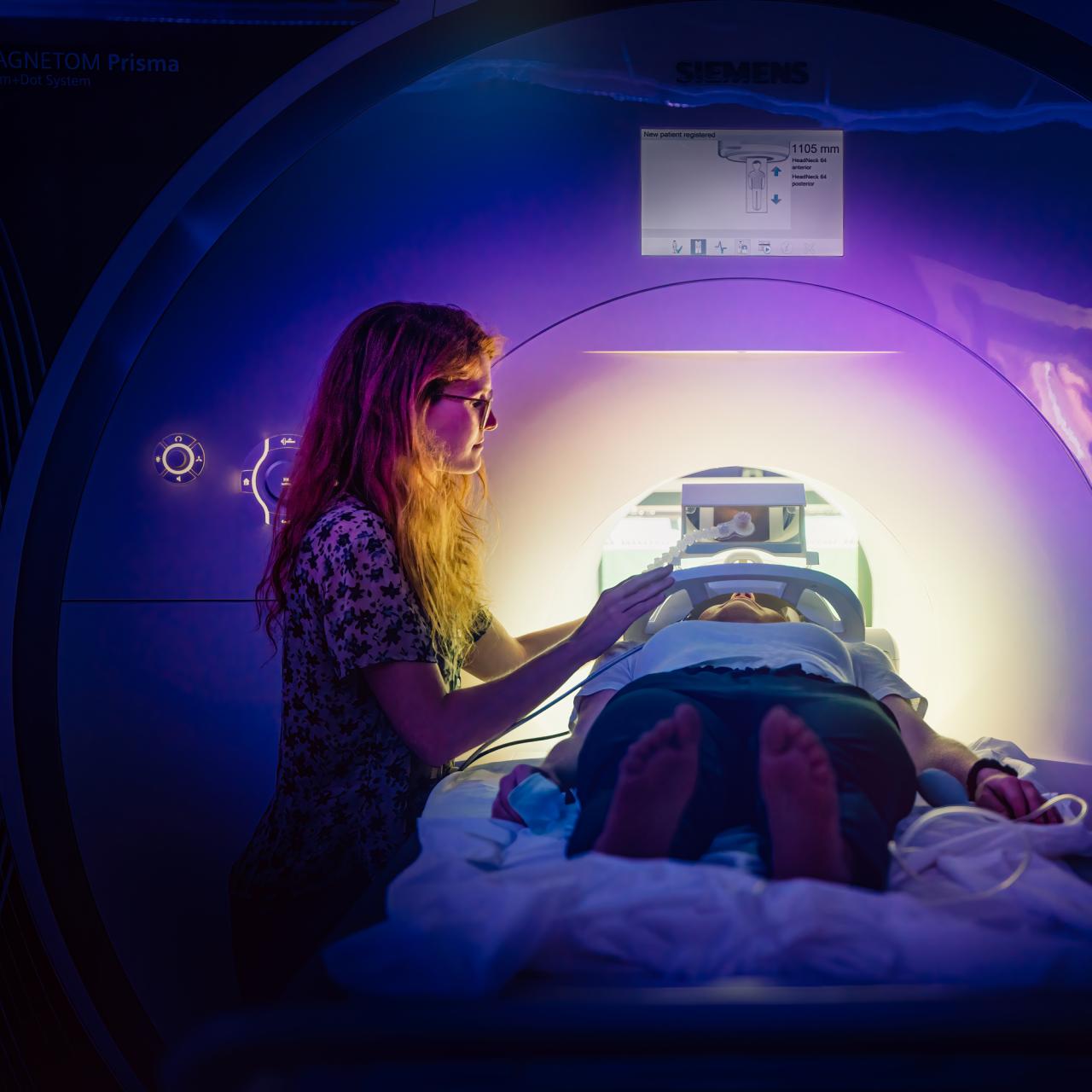 Researcher administering an fMRI scan.