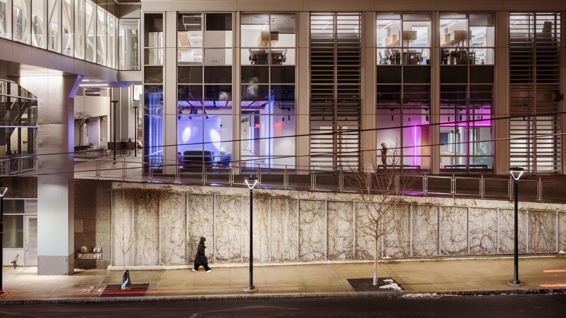 Exterior view of 100 College Street, including views of BrainWorks and the walking bridge from Sterling Hall of Medicine. Photo by Anton Grassl, courtesy of SmithGroup.