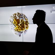 Joe Tsai viewing a demonstration in The Matrix at the Wu Tsai Institute