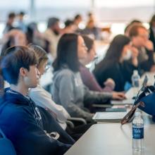Attendees listening to a presentation during WTI's symposium, Building Blocks of Behavior.