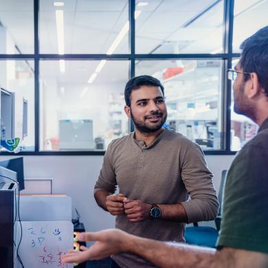 Two researchers having a conversation