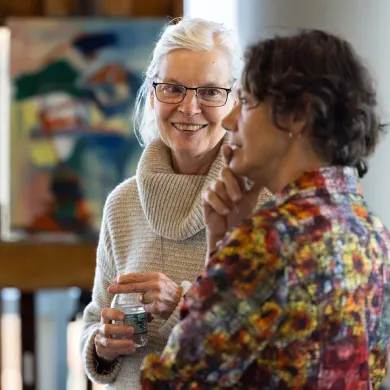 Prudence Whittlesey, left, speaks to Marina Picciotto, a faculty member at the Wu Tsai Institute
